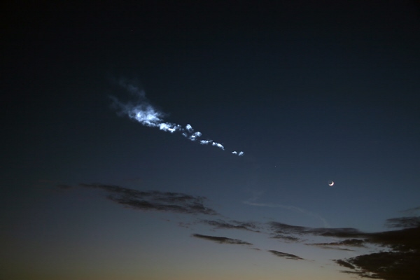 Image of Delta IV rocket trail, the Moon, and Venus following the NROL-22 launch